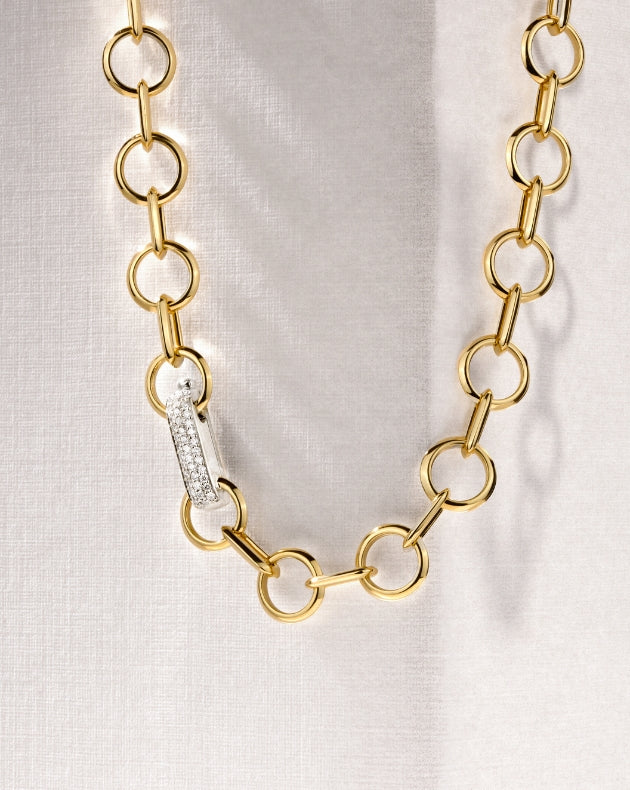 Canadian-made link necklace in 18K yellow gold with a pavé diamond and white gold clasp.