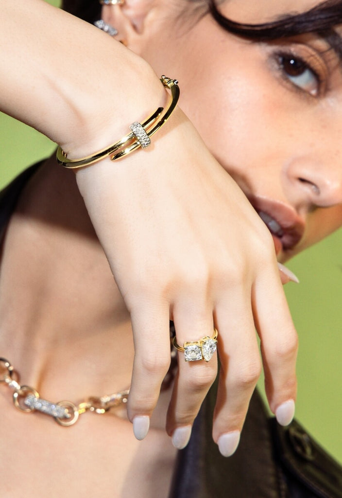 model wearing signature yellow gold duel bangle bracelet with diamond pave