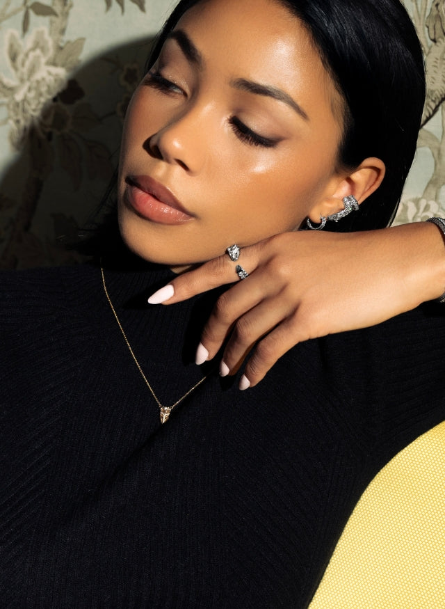 Model wearing 18k white and yellow gold fine jewelry by Ecksand made in canada. arctic dragon collection