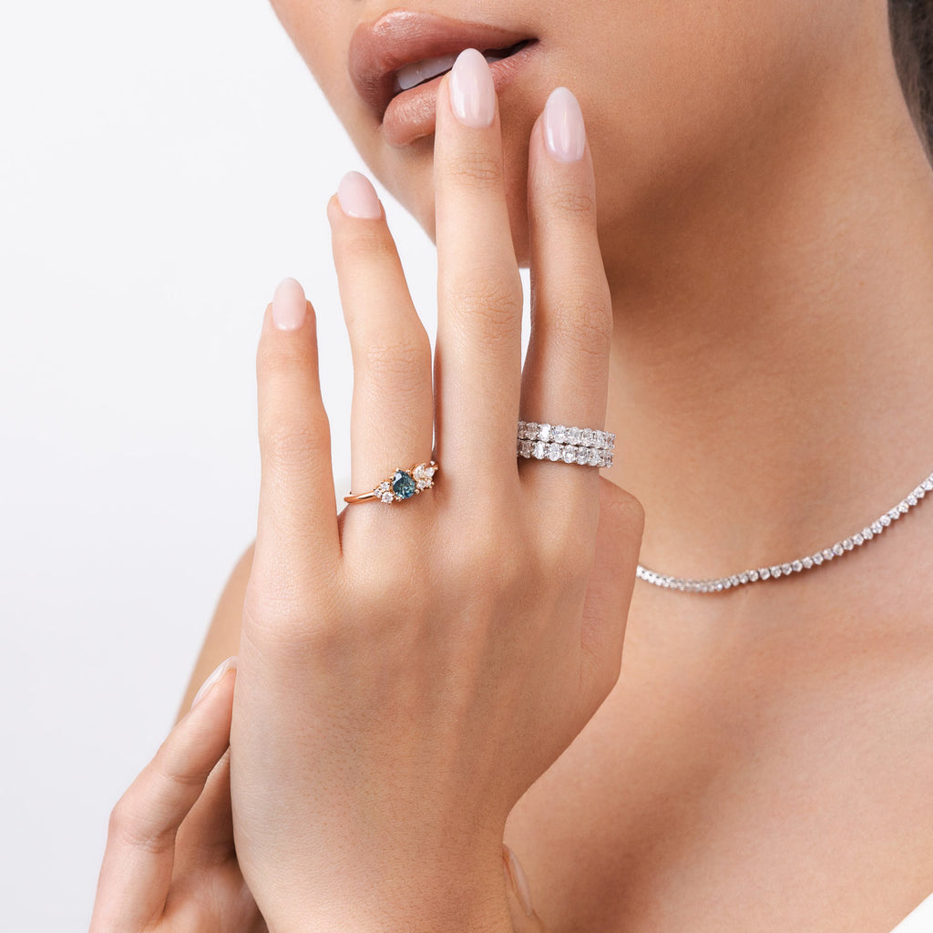 Model wearing Ecksand's Cluster Montana Sapphire Engagement Ring in 14k Rose Gold, Natural VS2+/ F+