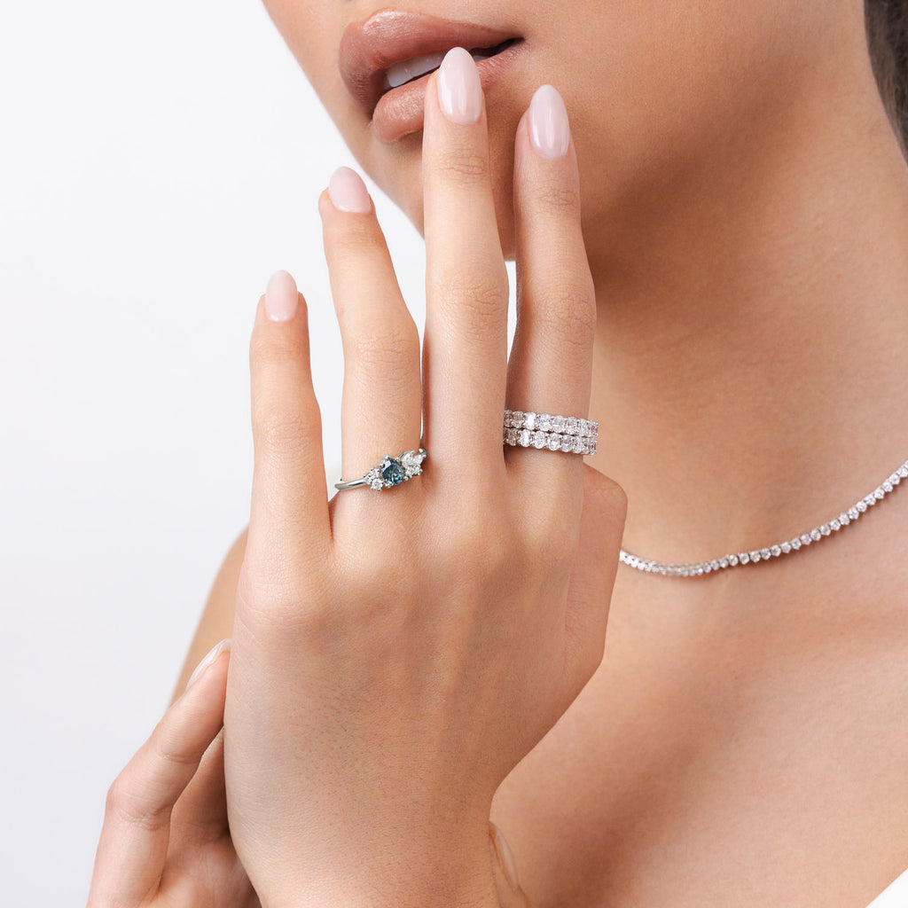 Model wearing Ecksand's Cluster Montana Sapphire Engagement Ring in Platinum, Natural VS2+/ F+