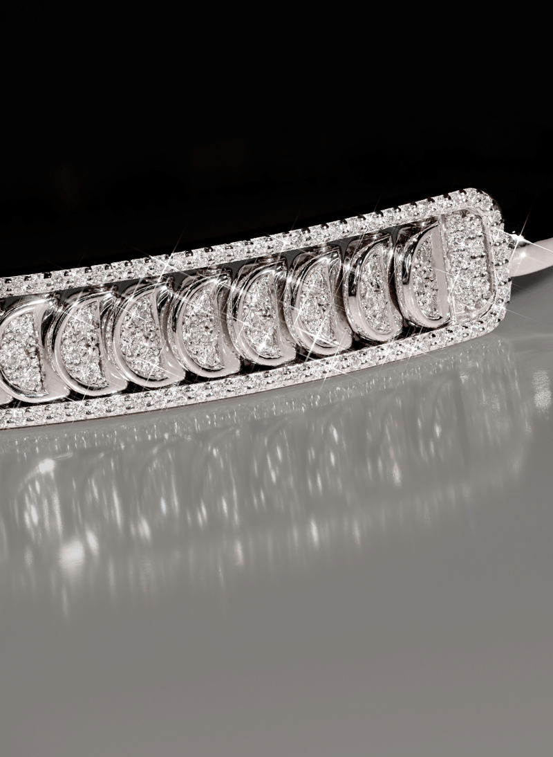 a canadian-made 18k white gold reversible diamond bangle from ecksand's aura chrome collection