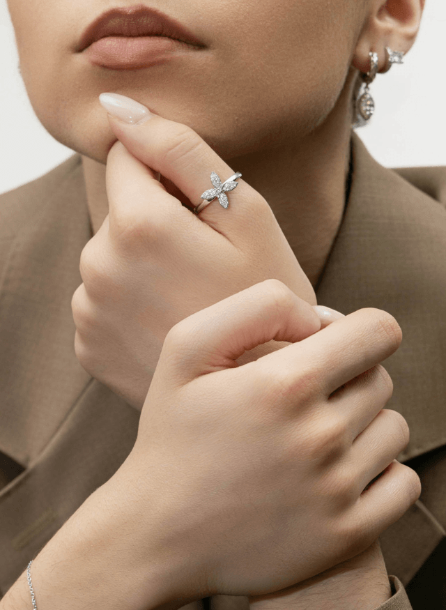 model wearing canadian-made 18k white gold butterfly diamond pave ring and reversble diamond ring from ecksand's wild collection