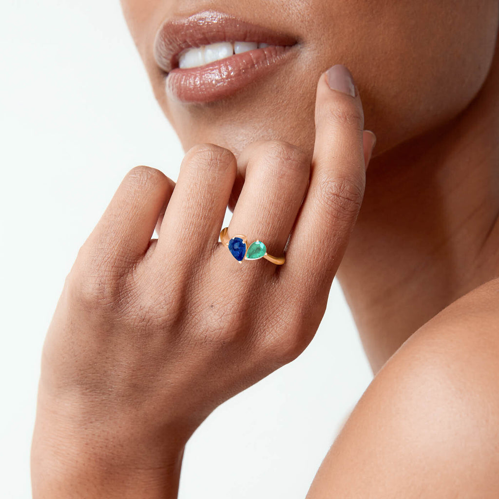 The Ecksand Emerald and Blue Sapphire Two-Stone Engagement Ring shown with  in 