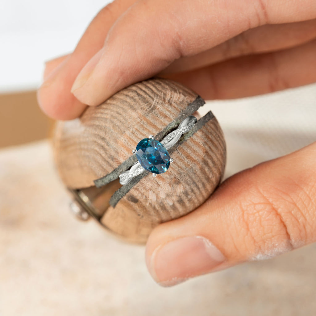 The Ecksand Blue Sapphire Engagement Ring with Secret Heart and Twisted Diamond Band shown with  in 