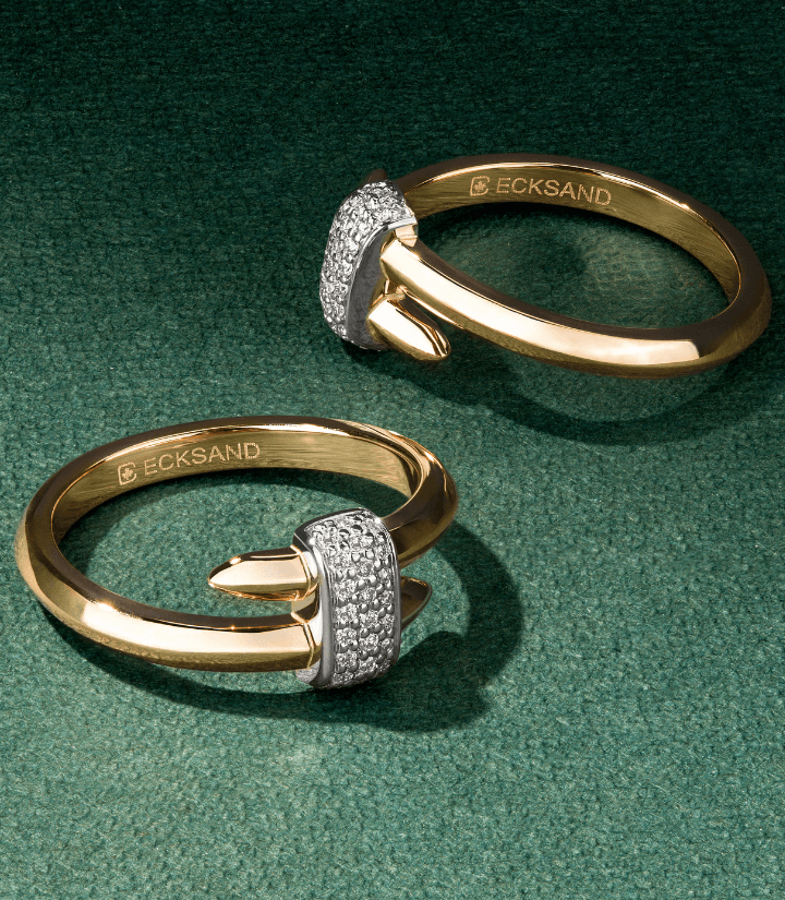 Canadian-made 18k yellow gold wrap rings with 18k white gold diamond pave centre on a green background