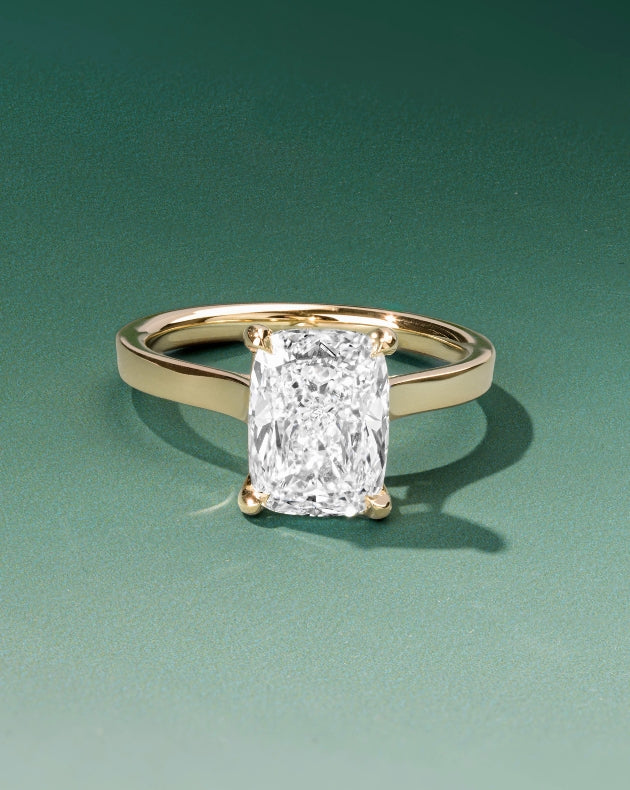 Canadian-made radiant diamond engagement ring with a gold band in 18K yellow gold.