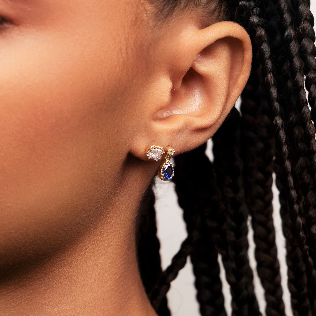 Model wearing Ecksand's Asscher Diamond Stud Earrings with Milgrain Halo in 18k Yellow Gold, Natural VS2+/ F+ #3