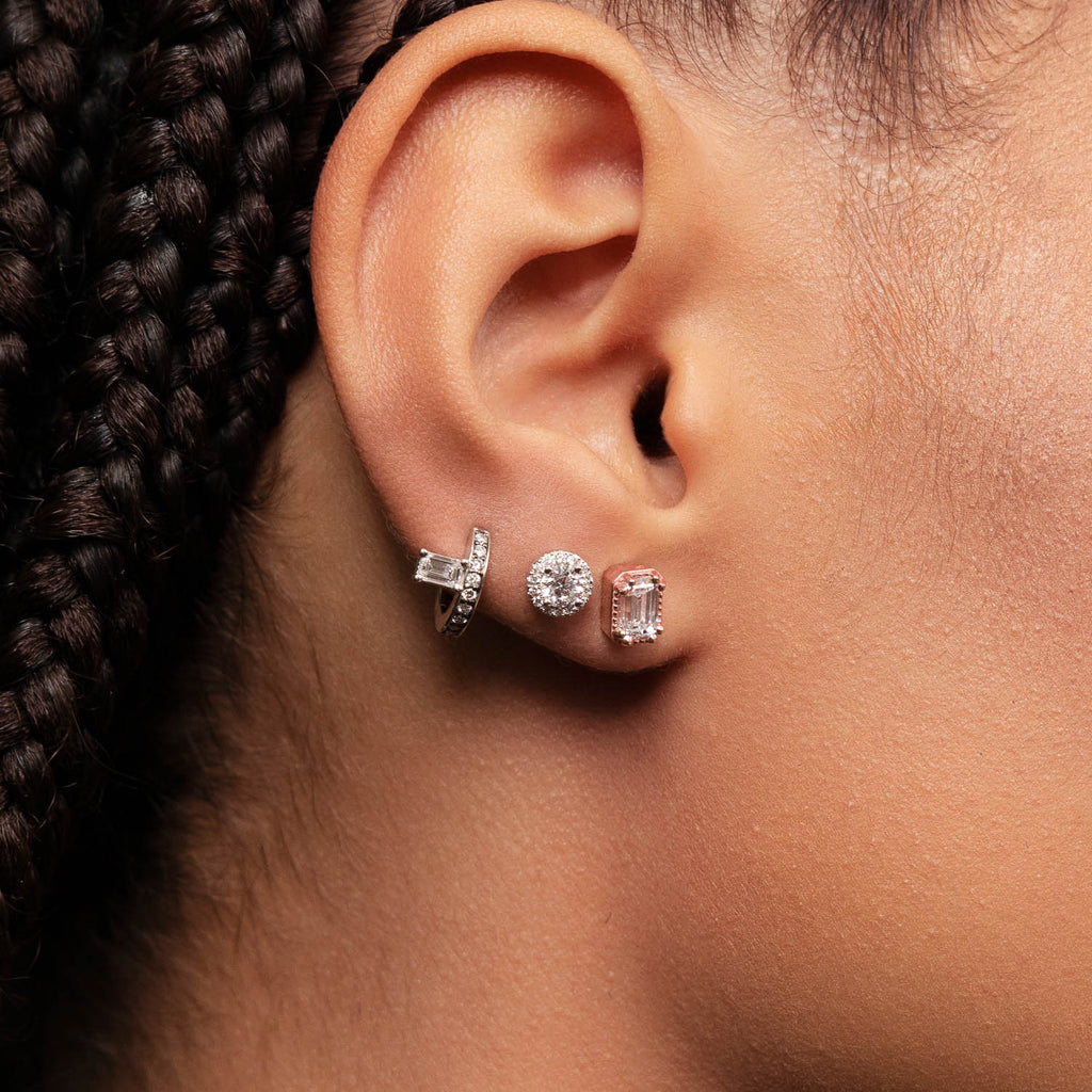 Model wearing Ecksand's Emerald Diamond Stud Earrings with Milgrain Halo in 18k Rose Gold, Lab-grown VS2+/ F+