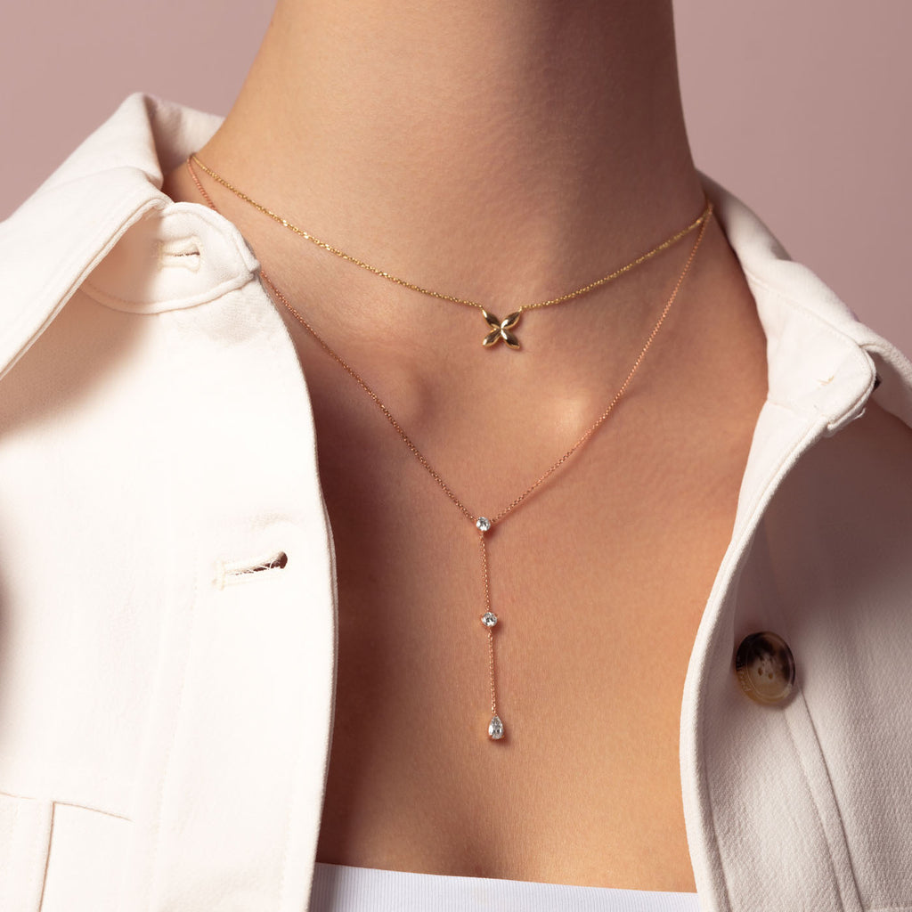 Model wearing Ecksand's Three-Stone Lariat Necklace in 18k Rose Gold, Lab-grown VS2+/ F+