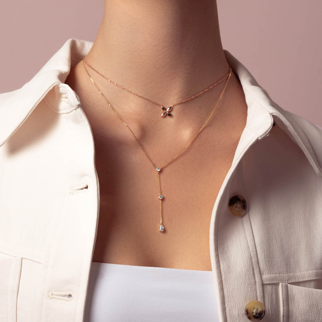 Model wearing Ecksand's Three-Stone Lariat Necklace in 18k Yellow Gold, Lab-grown VS2+/ F+