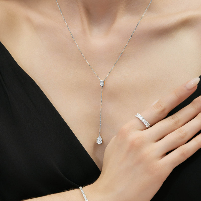 Lariat necklace with oval and pear diamonds in white gold. Fourth view on a model. - Collection: Starlight Diamond Jewelry