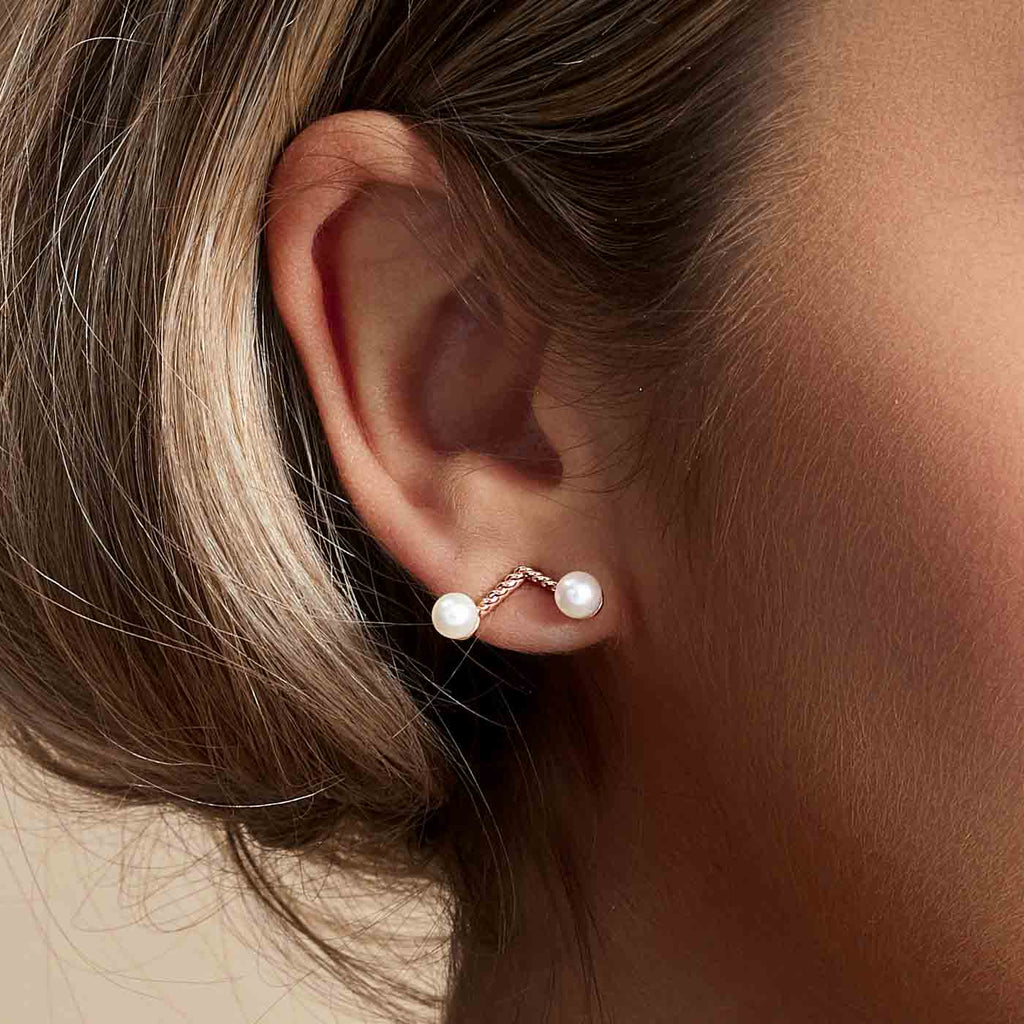 The Ecksand Twisted Freshwater Pearl Stud V Earrings shown with  in 