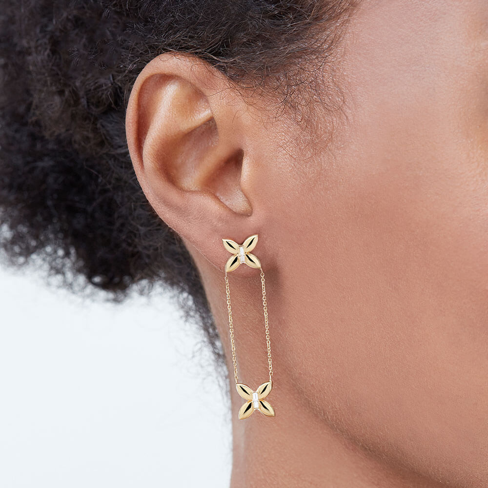 The Ecksand Butterfly Dangle Chain Earrings shown with  in 