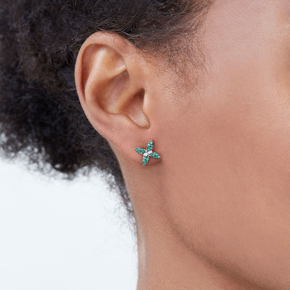 Model wearing Ecksand's Butterfly Earrings with Accent Emeralds and Diamonds in 18k Yellow Gold, Lab-grown VS2+/ F+