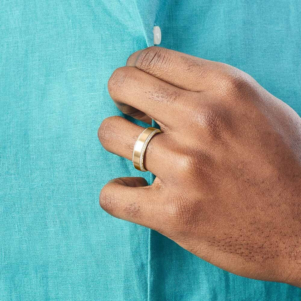 Model wearing Ecksand's Brushed Wedding Ring with Diamond Pave in 18k Yellow Gold, Lab-grown VS2+/ F+