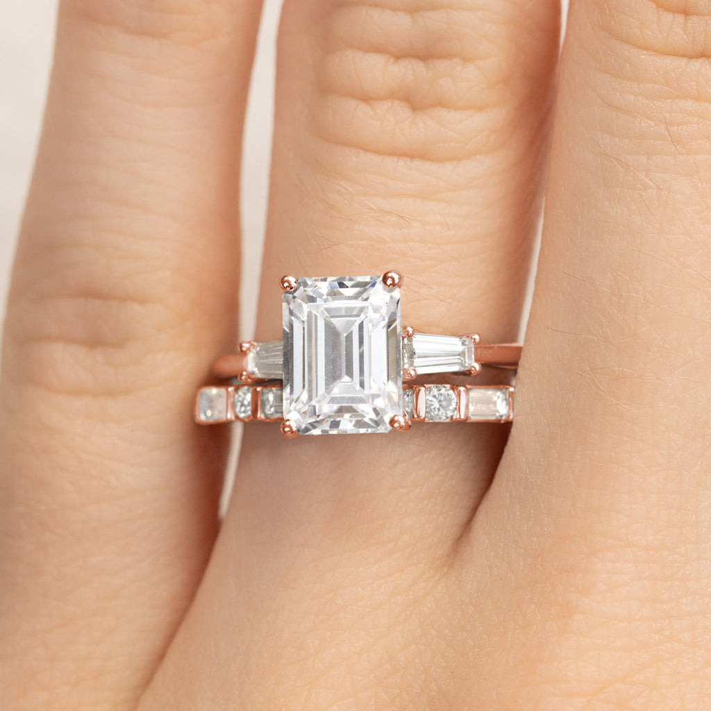 Ecksand emerald-cut diamond engagement ring and wedding band. Canadian-made bridal set in 14K rose gold.