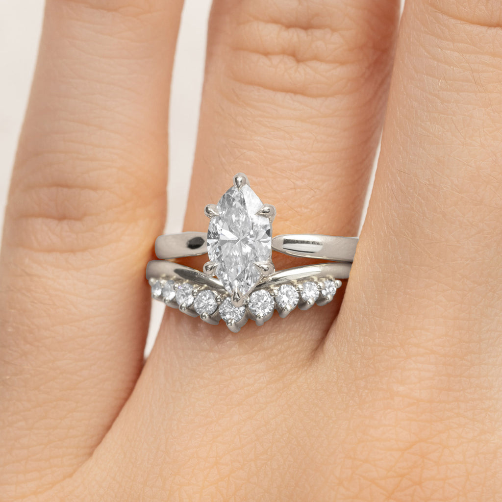 Canadian-made bridal set with a marquise diamond engagement ring and nesting wedding ring in 18K white gold.