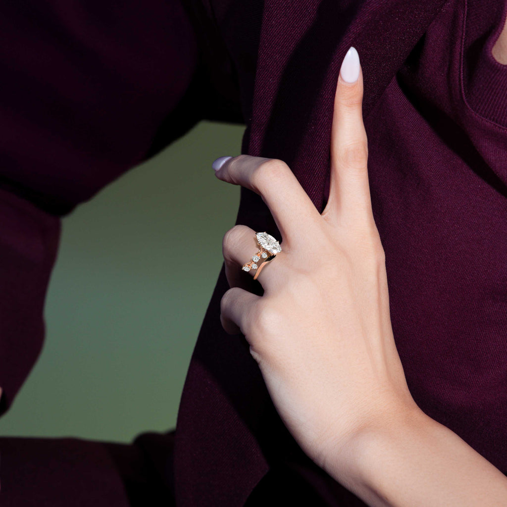Model wearing Iconic Interlocking X's Diamond Engagement Ring in Rose Gold
