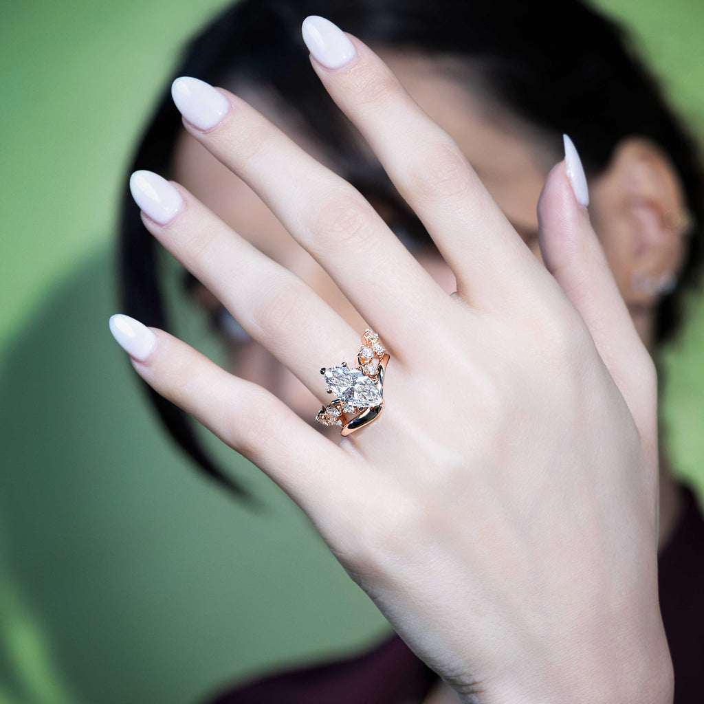 Model wearing Iconic Interlocking X's Diamond Engagement Ring in Rose Gold