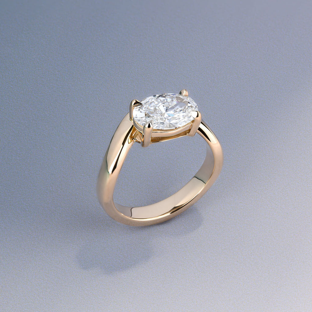 Canadian-made oval diamond engagement ring with a solitaire setting in 14K rose gold.