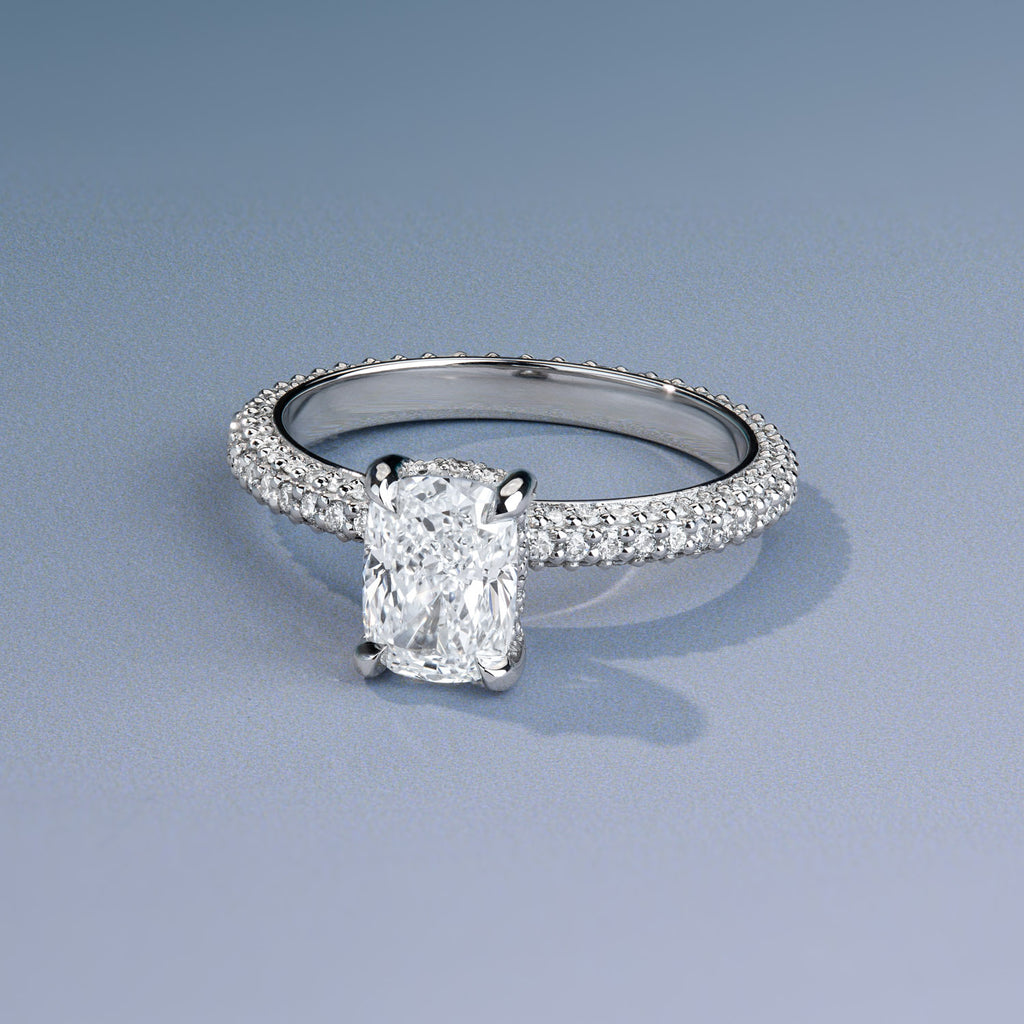Cushion cut diamond engagement ring with a pavé band in Canadian-made 18K white gold.