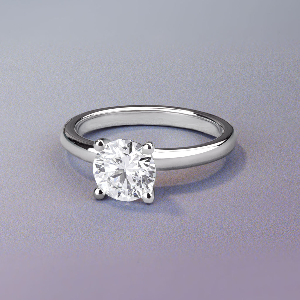 Canadian-made round diamond solitaire engagement ring in 18K white gold.