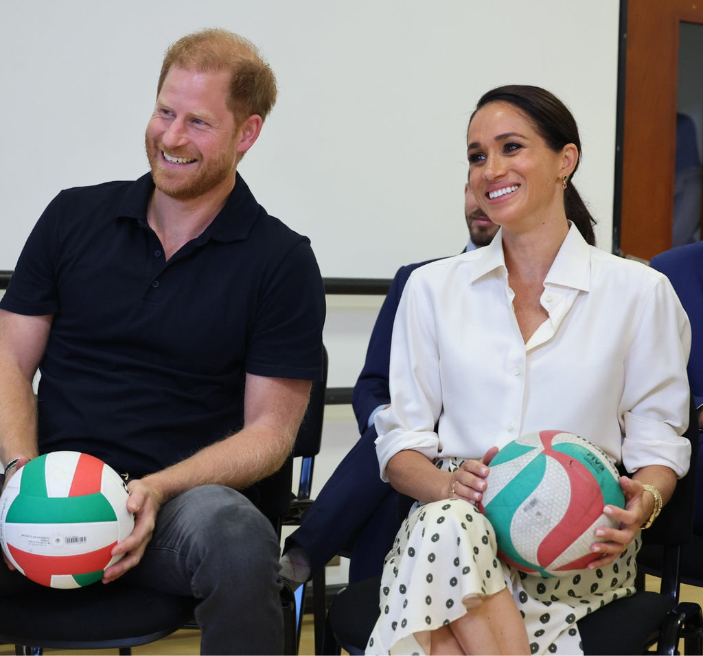 meghan markle wearing ecksand dangle emerald and pink sapphire earrings at invictus games