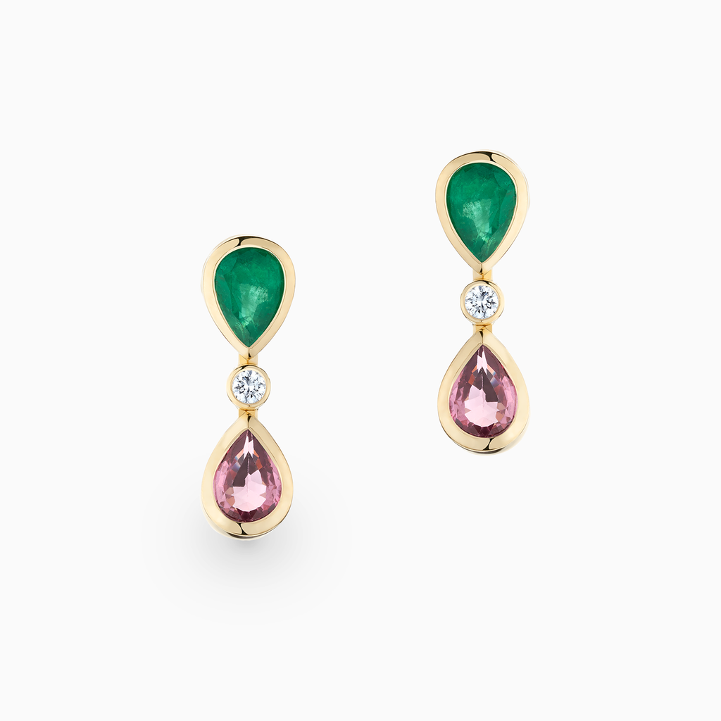 The Ecksand Emerald and Pink Sapphire Dangle Earrings with Accent Diamonds shown with Emeralds and Pink Sapphires 7x5mm in 14k Yellow Gold