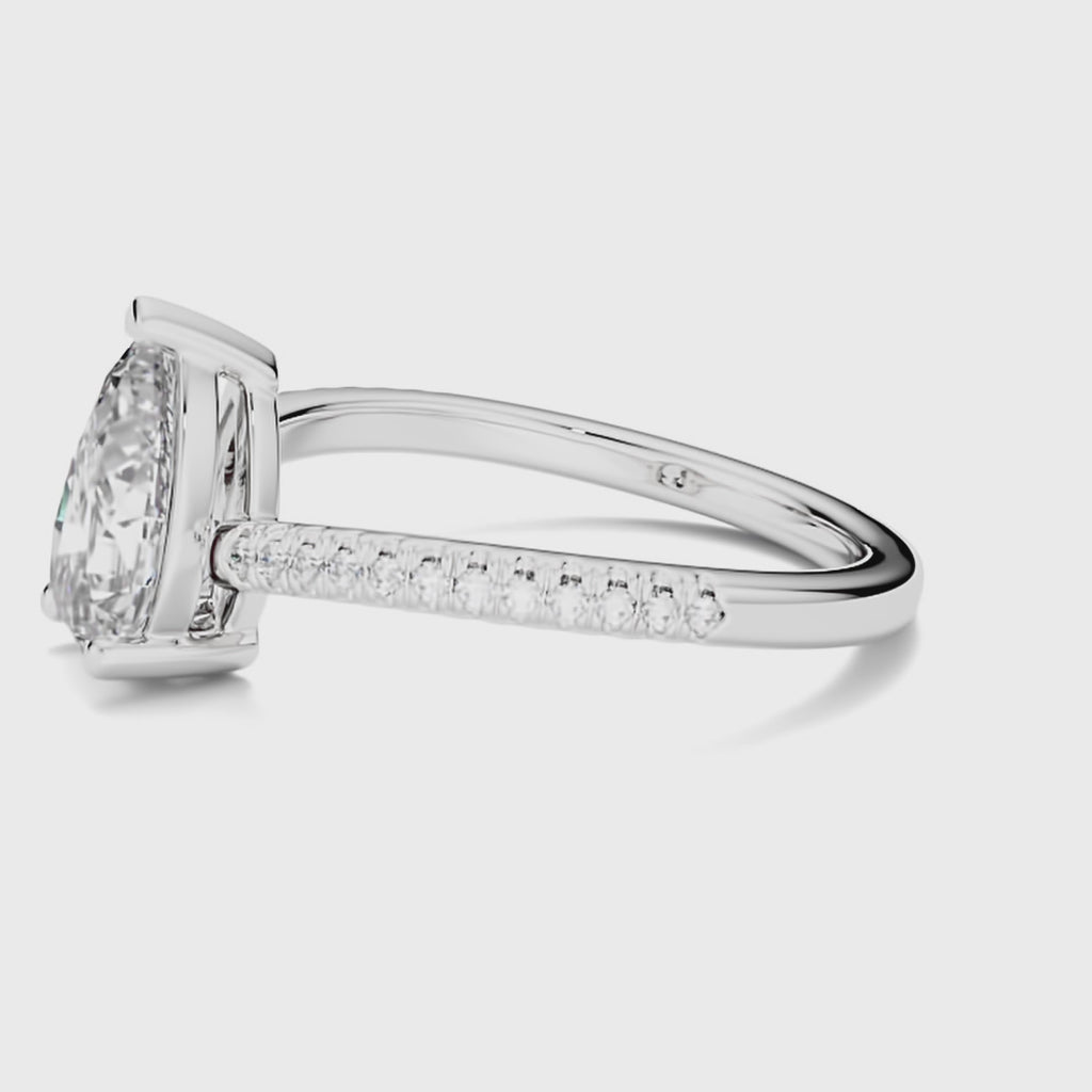 Video showcasing Ecksand's Diamond Engagement Ring with Curved Diamond Band in Platinum, Pear