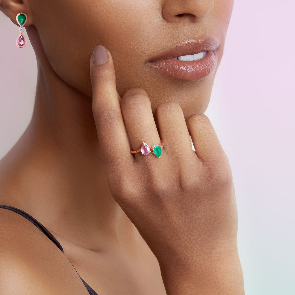 The Ecksand Two-Stone Pear-Cut Pink Sapphire and Emerald Ring shown with  in 