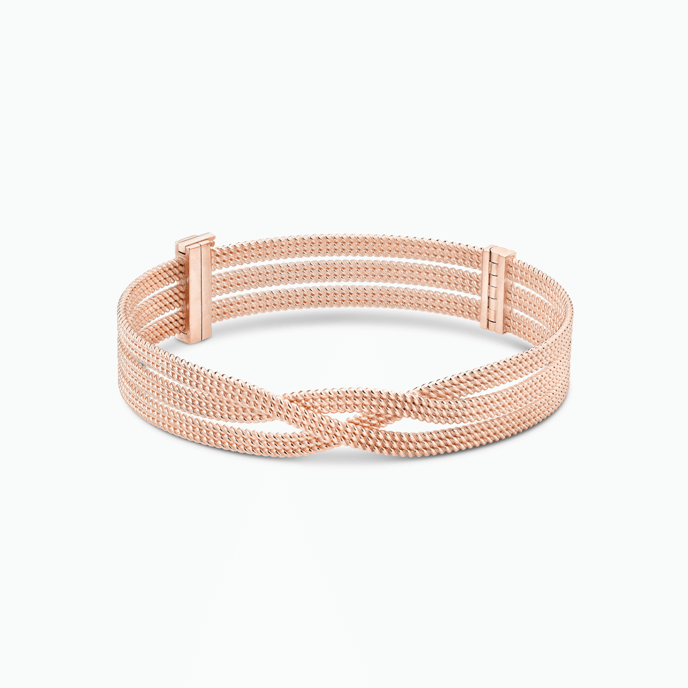The Ecksand Twisted Gold Bangle shown with  in 14k Rose Gold
