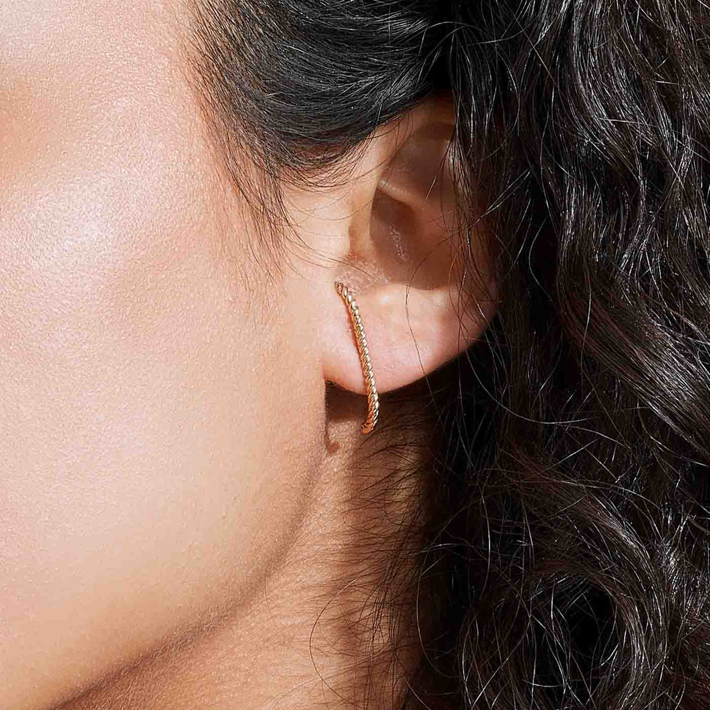 The Ecksand Twisted Gold Earlobe Cuff Earrings shown with  in 