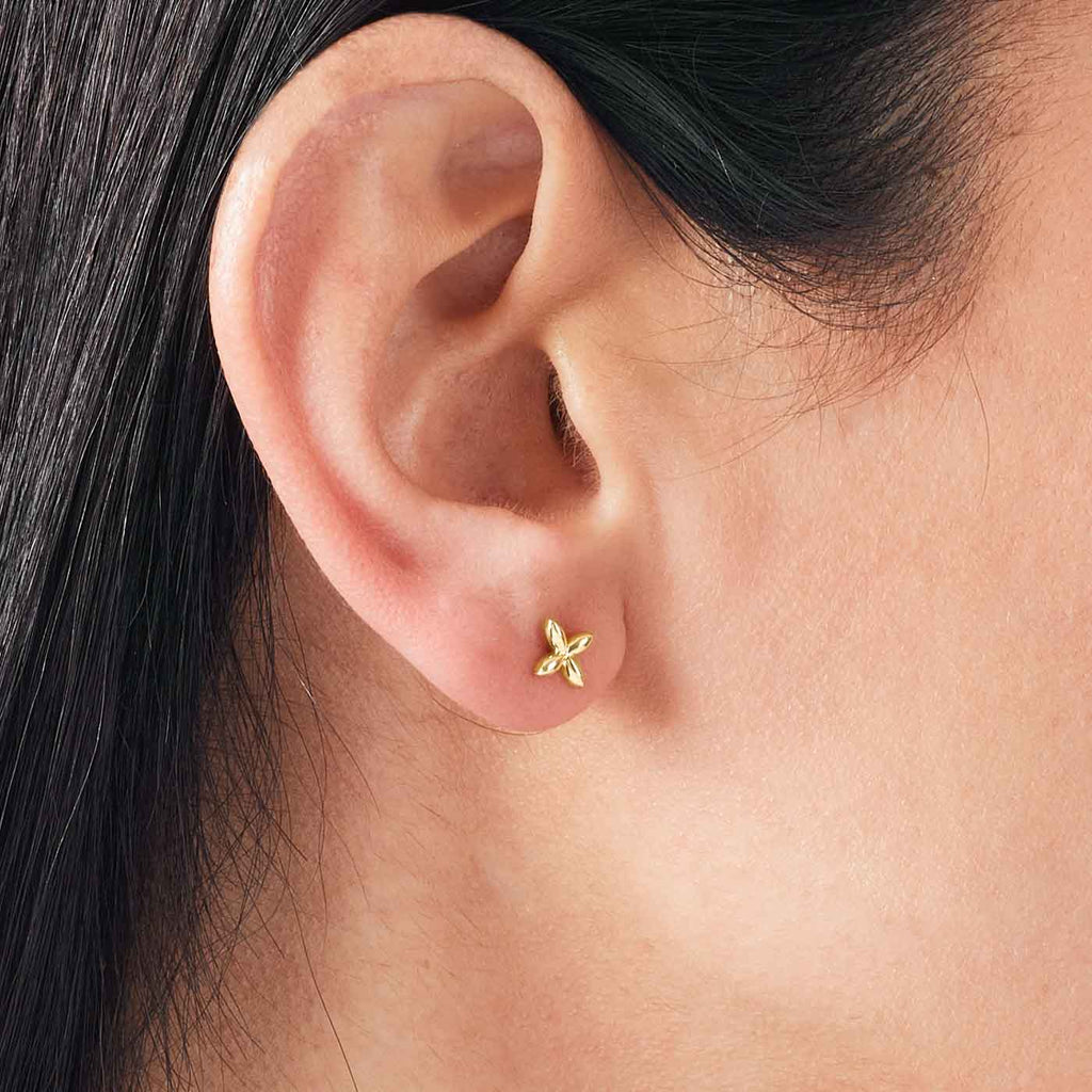 The Ecksand Gold Butterfly Stud Earrings shown with  in 