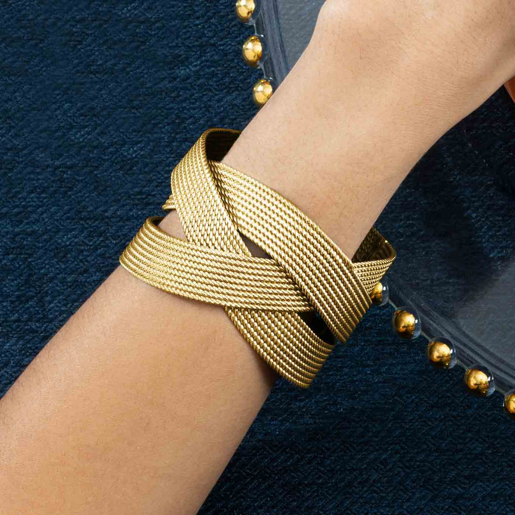 The Ecksand Twisted Gold Cuff Bangle shown with  in 