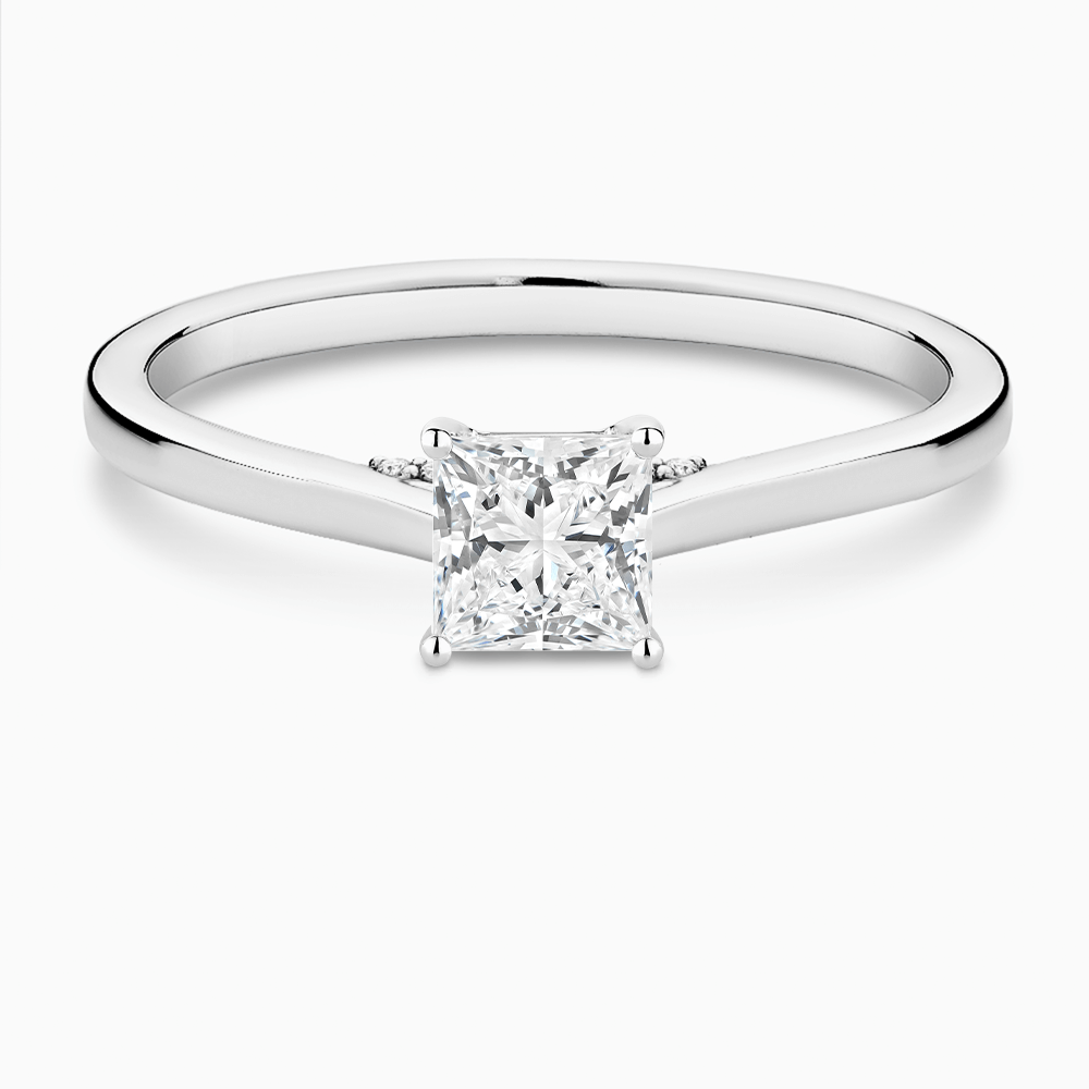 The Ecksand Solitaire Engagement Ring with Diamond Pavé Bridge and Hidden Diamond shown with Princess in 18k White Gold