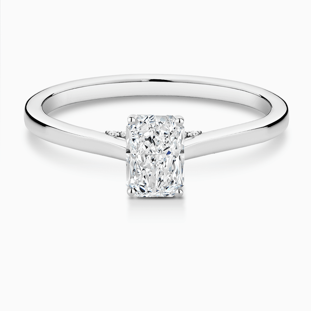 The Ecksand Solitaire Engagement Ring with Diamond Pavé Bridge and Hidden Diamond shown with Radiant in 18k White Gold