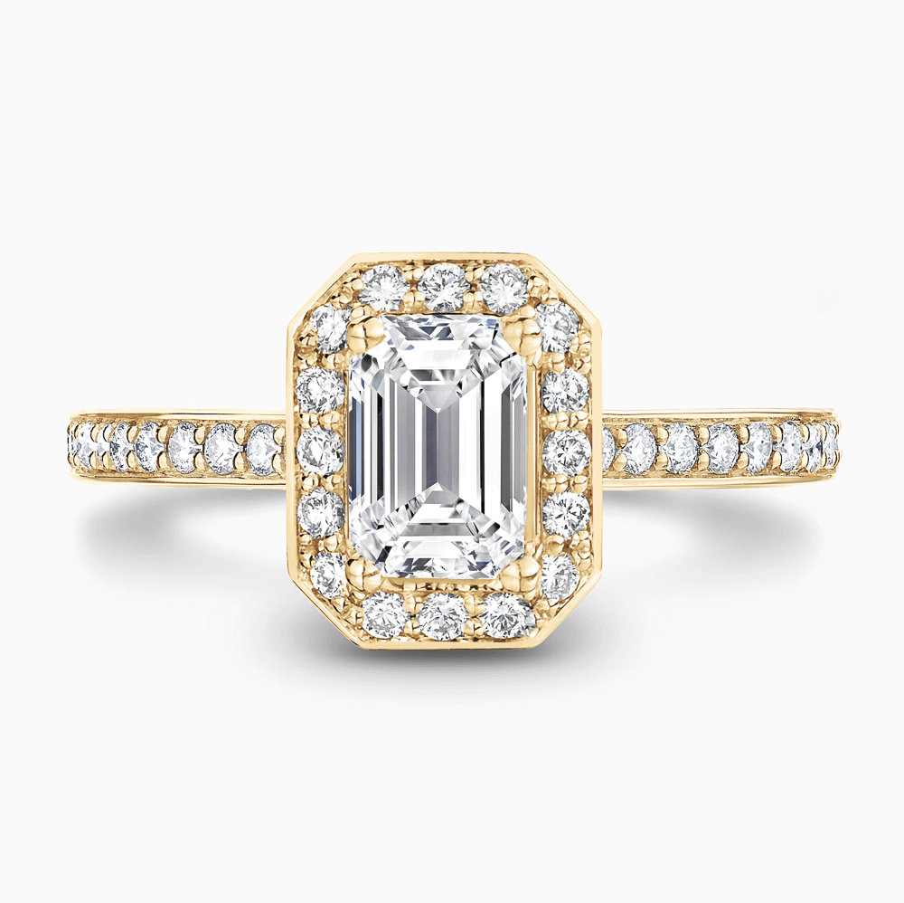 The Ecksand Diamond Halo Engagement Ring with Bright-Cut Diamond Band shown with Emerald in 18k Yellow Gold