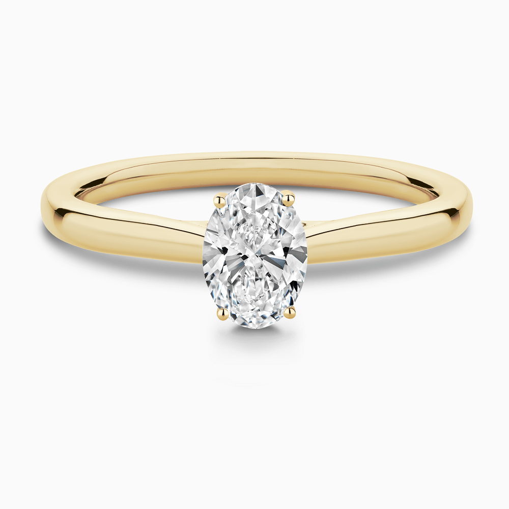 The Ecksand Solitaire Diamond Engagement Ring with Secret Heart shown with Oval in 18k Yellow Gold