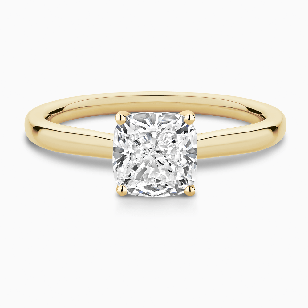 The Ecksand Solitaire Diamond Engagement Ring with Secret Heart shown with Cushion in 18k Yellow Gold