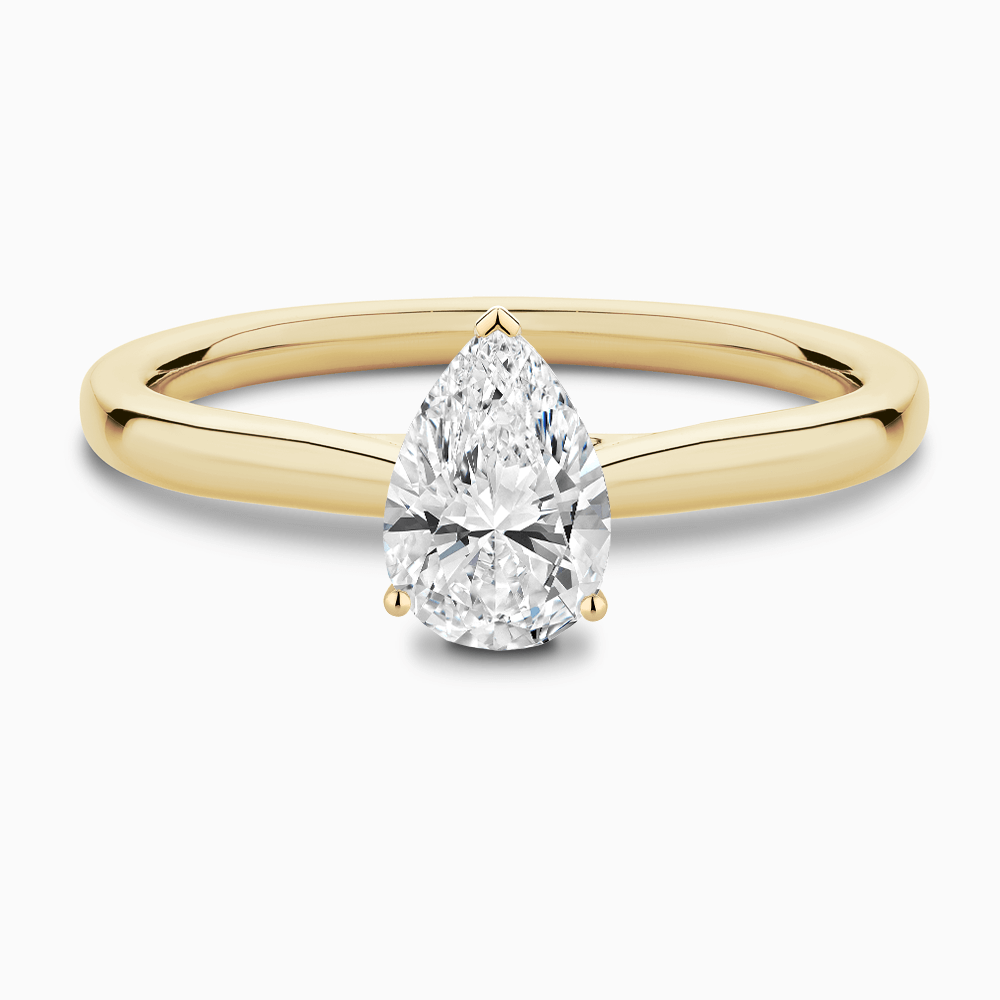 The Ecksand Solitaire Diamond Engagement Ring with Secret Heart shown with Pear in 18k Yellow Gold