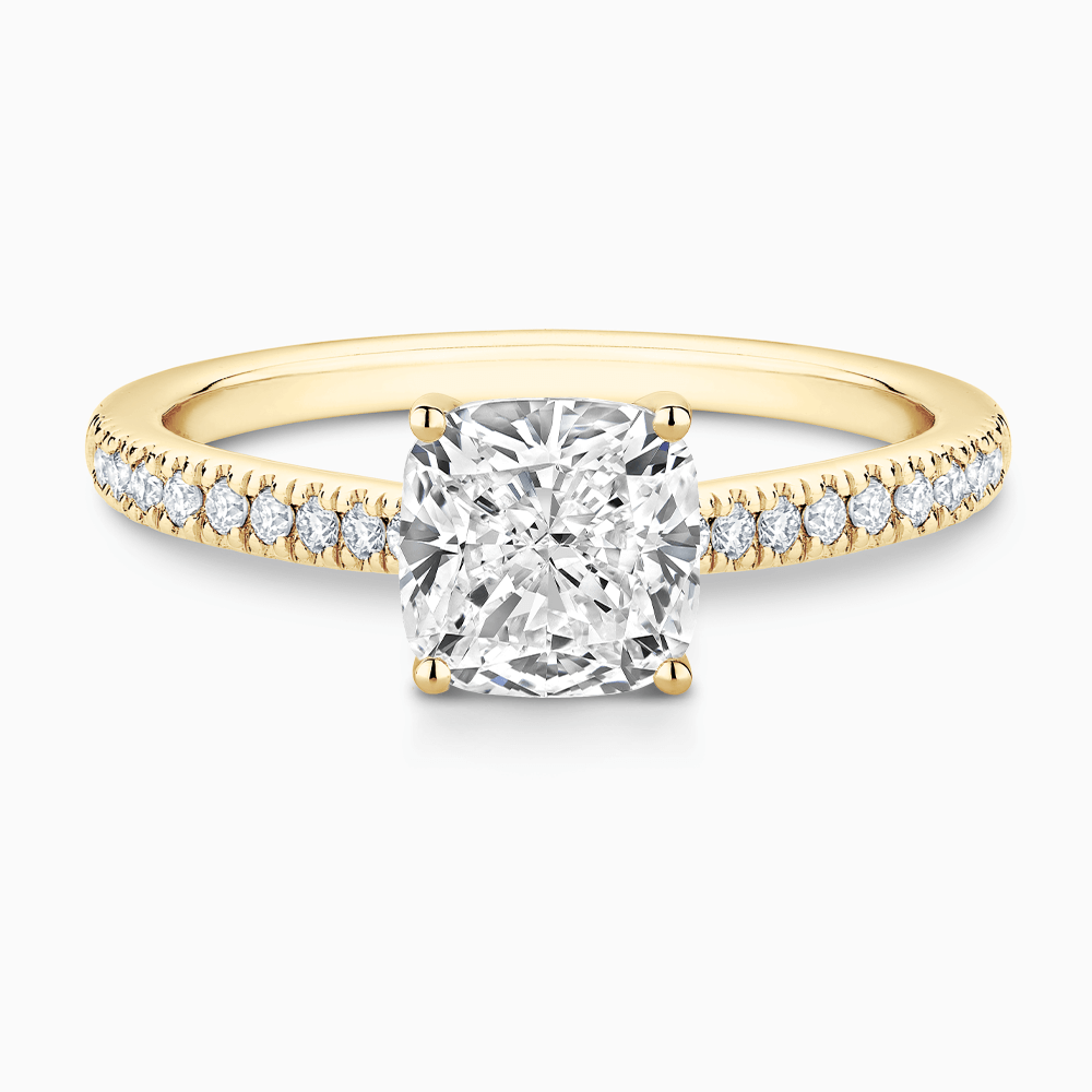 The Ecksand Diamond Engagement Ring with Secret Heart and Diamond Band shown with Cushion in 18k Yellow Gold