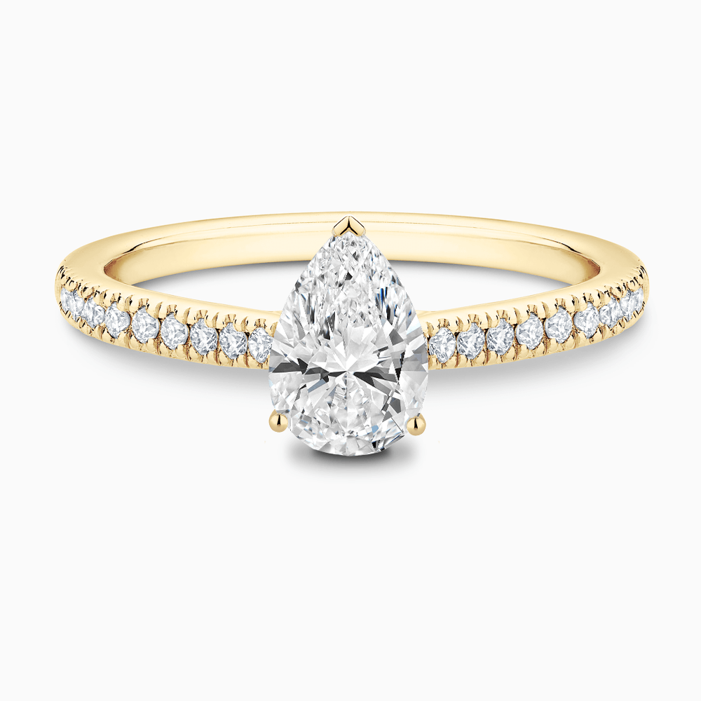 The Ecksand Diamond Engagement Ring with Secret Heart and Diamond Band shown with Pear in 18k Yellow Gold