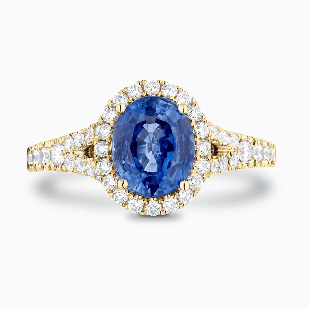The Ecksand Split Shank Blue Sapphire Engagement Ring with Diamond Halo shown with  in 18k Yellow Gold