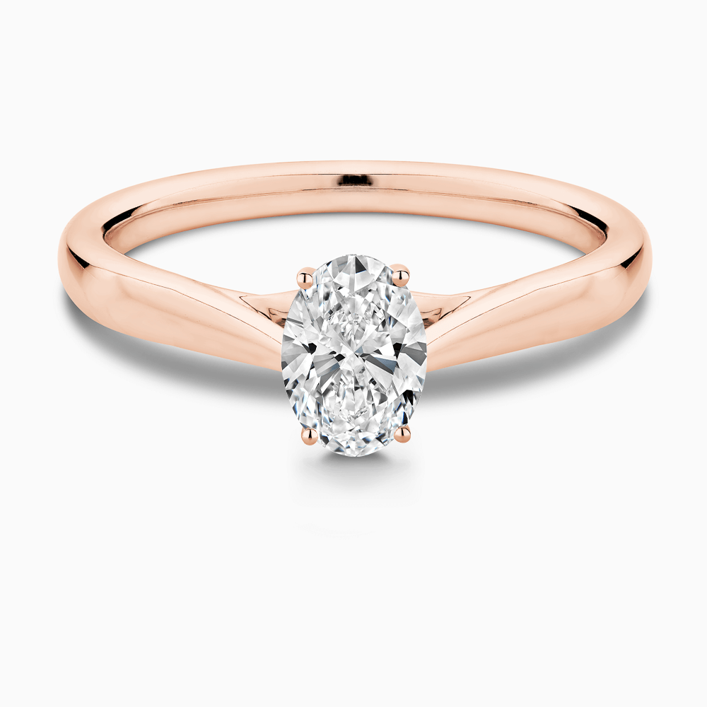 The Ecksand Tapered Band Solitaire Diamond Engagement Ring with Secret Heart shown with Oval in 14k Rose Gold