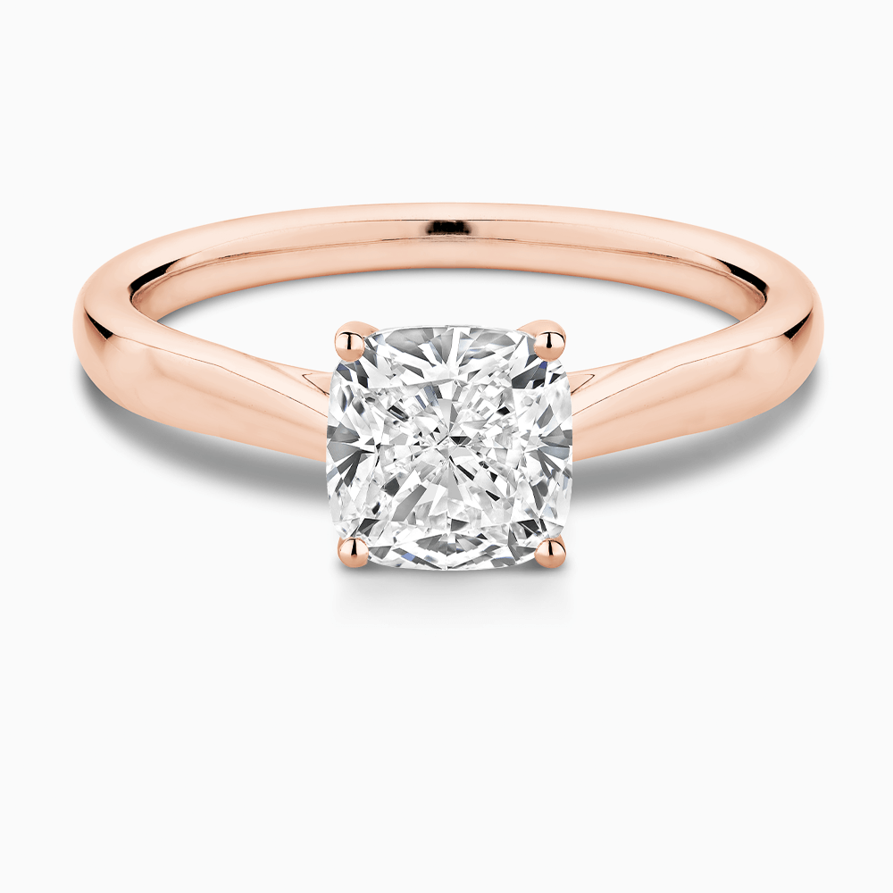 The Ecksand Iconic Tapered Band Solitaire Diamond Engagement Ring with Secret Heart shown with Cushion in 14k Rose Gold