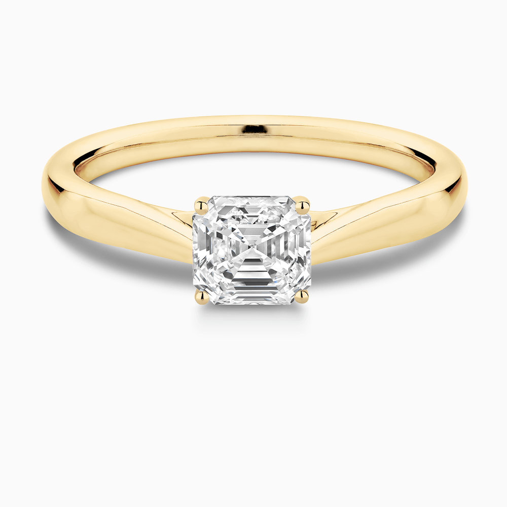 The Ecksand Tapered Band Solitaire Diamond Engagement Ring with Secret Heart shown with Asscher in 18k Yellow Gold