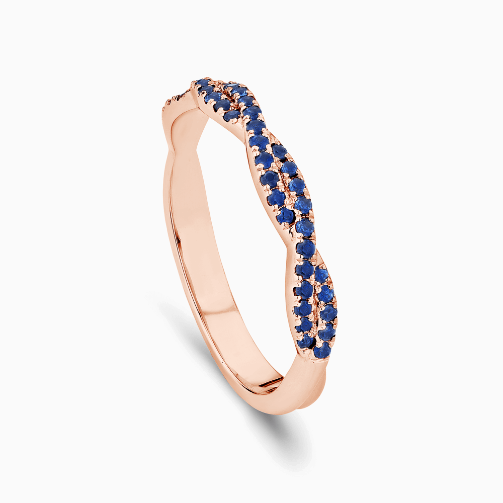 The Ecksand Twisted Wedding Ring with Blue Sapphire Pavé shown with  in 