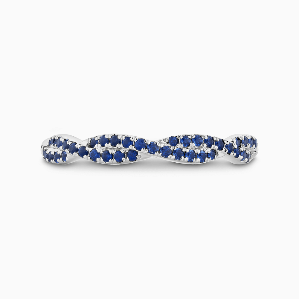 The Ecksand Twisted Wedding Ring with Blue Sapphire Pavé shown with  in Platinum
