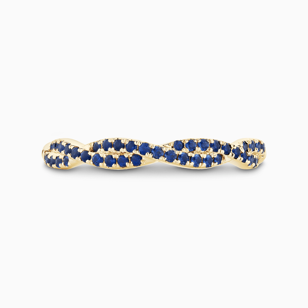 The Ecksand Twisted Wedding Ring with Blue Sapphire Pavé shown with  in 18k Yellow Gold